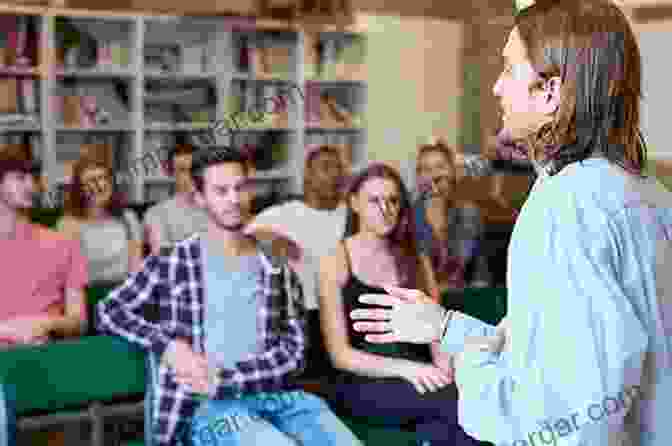 A Group Of Students Learning About Broadcast Journalism In A University Classroom, With A Professor Lecturing On The Latest Techniques And Technologies. Red: Peter Ibbotson: British Broadcasting In The 21st Century