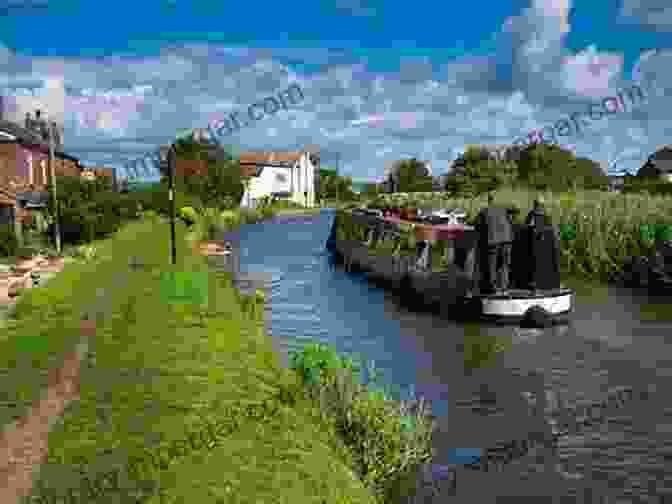 A Narrowboat Gracefully Navigating A Tranquil Canal Canals In Britain (Shire Library)