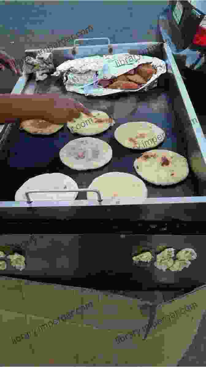 A Street Vendor Selling Pupusas In A Busy Market In Los Angeles. New Complete Los Angeles Street Food With A History From Tamaleros To Taco Trucks